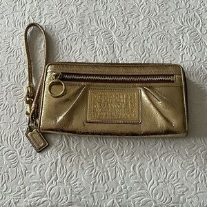 Gold coach wristlet